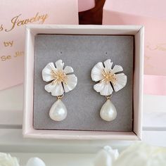 * DETAILS * - Teardrop shaped Freshwater White Pearls  - White Flower Gold Plated Post Earrings  🌟More earrings. https://www.etsy.com/JinnysJewelryBySeJin/listing/1100504878/freshwater-pearl-dangle-earrings-pearl?utm_source=Copy&utm_medium=ListingManager&utm_campaign=Share&utm_term=so.lmsm&share_time=1636052013167 🎁A designer pull drawer pink gift box is available when the gift wrapping option is chosen. -------------------------------------------------- * CARE TIPS * ⭐️TO PREVENT TARNISH: Kee White Teardrop Flower Earrings, White Teardrop Bridal Earrings For Pierced Ears, White Teardrop Flower Earrings For Anniversary, White Teardrop Flower Earrings With Pearl Drop, White Teardrop Dangle Earrings For Anniversary, White Teardrop Flower Earrings For Gift, White Pearl Drop Clip-on Earrings For Gift, White Teardrop Clip-on Earrings For Gifts, White Drop Earrings Gift