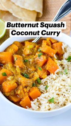 butternut squash coconut curry in a white bowl with rice and cilantro on the side