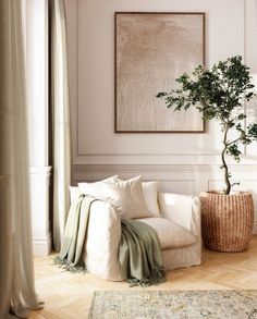 a living room filled with furniture and a potted plant