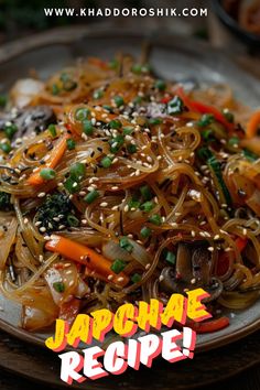 a plate full of noodles and vegetables with the words japanese recipe written in front of it