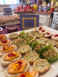 a table topped with lots of different types of appetizers next to each other