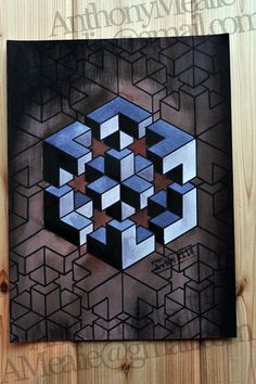 an abstract painting on wood with black and blue squares in the center, surrounded by smaller cubes