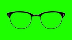 a pair of black glasses against a green background with the reflection of the glasses on it