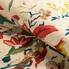 the fabric is very colorful and has flowers on it