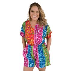 Live Ambitiously Romper This fun floral print romper is a fabulous lightweight woven poplin material! The bright colored romper has a v-neck and elastic waist. it. Slide on a pair of sandals and you are ready for the day! Fabric Content: 100% rayon Sizing: S: 2-6, M: 8-10, L: 12-14, XL: 14-16, 1XL: 16-18, 2XL: 20-22, 3XL: 24-26 Models:Alicia (curly blonde hair): 5'5" size small top, size 4 bottoms Mattie (curly brunette hair): size medium top, size 8 bottomsKim (straight brunette hair): 5'7" siz Vacation Jumpsuits And Rompers With V-neck And Elastic Waistband, Casual Patterned Jumpsuits And Rompers For Vacation, Casual Multicolor Short Sleeve Jumpsuits And Rompers, Summer V-neck Jumpsuits And Rompers With Elastic Waistband, Spring Casual Multicolor Print Jumpsuits And Rompers, Casual Multicolor Print Jumpsuits And Rompers For Vacation, Casual Multicolor Jumpsuits And Rompers With Elastic Waistband, Beach Patterned Jumpsuits And Rompers, Vibrant Print Summer Jumpsuits And Rompers