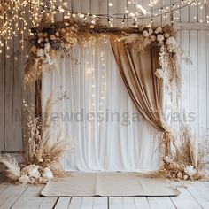 an image of a stage set up for a wedding ceremony with flowers and greenery