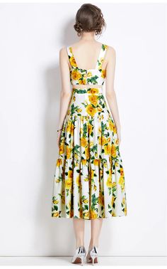 Oftentimes, a dress comes along that perfectly captures the essence of summer, and this sunflower-print dress does just that. The vibrant yellow blooms set against a fresh white background evoke sunny days spent outdoors. This dress features a sleeveless design and a fitted bodice that flares into a playful, tiered skirt, making it ideal for twirling on a dance floor or strolling through a weekend market. The lightweight fabric ensures breathability and comfort, while the overall design flatters