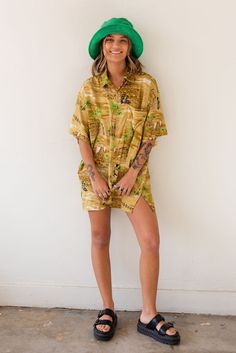 Vintage x Resurrection Hawaiiana Oversized Button Shirt features a retro Hawaiian design with button down front and chest pocket. Color: Gold/Green Multi Oversized Fit Short Sleeve Silk Brand: Creations Mens Size Large There will be imperfections and flaws that make this jacket unique in character with no two alike. There are some minor tears. These are not defects and simply lend to the character of this extra special piece. VINTAGE - FINAL SALE ITEM Collared Hawaiian Shirt With Pockets For Beach, Relaxed Fit Collared Hawaiian Shirt With Pockets, Retro Hawaiian Shirt With Relaxed Fit, Oversized Printed Collared Shirt, Vintage Oversized Shirt With Pockets, Retro Spring Hawaiian Shirt With Relaxed Fit, Retro Hawaiian Shirt For Spring With Relaxed Fit, Retro Hawaiian Shirt For Spring, Retro Relaxed Fit Hawaiian Shirt For Spring