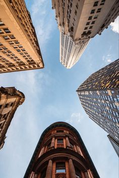 looking up at tall buildings in the city