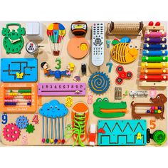 an assortment of wooden toys including crayons, pencils, markers and magnets