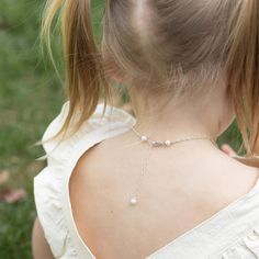 She is one lucky little lady! A petite (fits on a dime) shiny sterling silver four-leaf clover charm mingles with a gorgeous freshwater pearl and her very own special birthday gem. A wonderful and lovely reminder that she always carries her very own luck with her, on all of her adventures. Her lucky charm necklace includes: sterling clover charm (from tippy-top to bottom, a bit smaller than a dime) cultured freshwater pearl charm genuine birthday gem dangle charm [split] Details about your neckl Elegant Silver Charm Necklace With May Birthstone, Personalized Silver Pearl Necklace, Elegant Silver Hypoallergenic Birthstone Necklace, Delicate Silver Charm Necklaces For Birthday, Hypoallergenic Pearl Jewelry For Birthdays, Dainty Pearl Jewelry For Birthdays, Dainty Pearl Jewelry For Birthday, Charming Pearl Charm Jewelry For Gift, Pearl Jewelry For Birthday