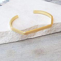 The Gold Minimalist Cuff Bracelet brings a classic style to your everyday piece. With a polished finish, this skinny bracelet is 14K gold filled. You can wear this piece on its own or stack it with other HLcollection bracelets. PRODUCT DETAILS: 4 mm wide bracelet. Open cuff - will fit most wrists MATERIALS: 14K Gold Filled 14K Gold Filled jewelry is not the same as gold-plated jewelry. It contains 5% of solid gold and is done by a process of heat bonding. The layer of gold is permanently bonded Minimalist Stackable Gold Cuff Bracelet, Minimalist Gold Stackable Cuff Bracelet, Adjustable Matte Gold Minimalist Bracelet, Minimalist Yellow Gold Cuff Bracelet, Minimalist Stackable Cuff Bangle Bracelet, Minimalist Gold Cuff Bracelet For Everyday Wear, Minimalist Stackable Cuff Bangle, Minimalist Stackable Gold Bracelet, Everyday Gold Minimalist Cuff Bracelet