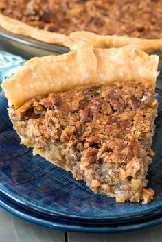 a slice of pecan pie on a blue plate