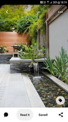 an outdoor garden with water features and landscaping