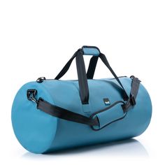 a blue duffel bag sitting on top of a white floor