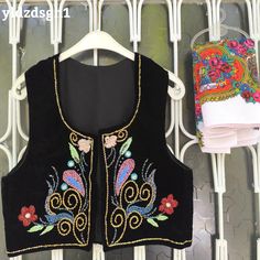 ❤️ Beautiful black vest with HANDMADE embroidery beaded flowers. This piece is truly a work of art! Our handmade vests are beautiful, stylish works of art combined with beads and sequins. The beads are charmingly arranged in colors that match perfectly with the carefully selected fabric. They are modern crop top style vests with a twist of indigenous and traditional textile from Mardin.  You can use it comfortably in your daily life or on special occasions. 💫 "Wearing it feels like getting a hu Bohemian Black Embroidered Vest, Stylish Words, Handmade Vest, Embroidery Beaded, Velvet Vest, Vintage Vest, Scarf Gift, Black Vest, Vest Outfits