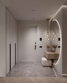 a modern bathroom with wooden walls and flooring is illuminated by round light bulbs that hang from the ceiling