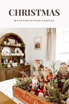 A red vintage Coca Cola crate holds a collection of Santa figures and is being used as a Christmas centerpiece. Decorating With Santa Collection, Christmas Coke Crate, Soda Crate Christmas Decor, Santa Claus Collection Display, Display Santa Collection, Vintage Santa Collection, Santa Claus Display Ideas, Christmas Hutch Display, Christmas Mug Decor