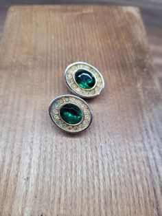 A beautiful pair of 1950s gold tone and faux emerald clip on earrings by Sphinx. They measure 1.9cm L x 1.3cm W.  They have some minor wear in the form of surface marks and mild patina to metal but overall good considering they are over 70 years old. If you have any questions please feel free to drop me a message:) Please note the postage cost to USA reflects tracked postage and can take up to 14 days. Classic Green Clip-on Earrings, Green Clip-on Earrings For Formal Occasions, Green Clip-on Formal Earrings, Classic Green Clip-on Earrings For Formal Occasions, Green Clip-on Metal Earrings, Green Oval Clip-on Earrings, Oval Green Clip-on Earrings, Retro Green Clip-on Earrings, Green Clip-on Earrings For Anniversary