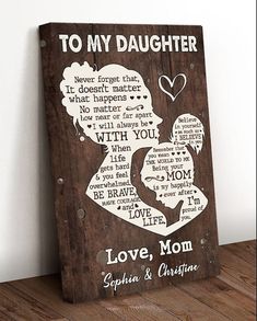 a wooden sign with the words to my daughter on it