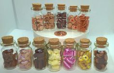 Mad about cookies collection Set of 12 assorted cookie jars filled with cookies- loose in glass cookie jar - 12th scale Please see following for item information and details 12 x Biscuit jars Jar measurement 4cm high without cork 4.5cm high with cork, 2cm diameter  Biscuit quantity in each jar and  individual biscuit measurements 10 x pink wafer biscuits  item measurement L -13mm W - 5mm H- 3mm 10 x bourbon biscuits  Item measurement L-13mm W- 5mm H - 3mm 25 x chocolate biscuits Item measurement Bourbon Biscuits, Oreo Biscuits, Glass Cookie Jars, Yellow Party, Miniature Set, Double Chocolate Chip Cookies, Miniature Projects, Biscuit Jar, Tiny Food