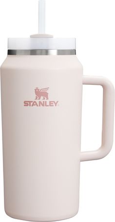 the stanley coffee mug is white and has a stainless steel lid with a plastic handle