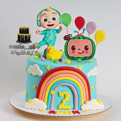 a birthday cake with a cartoon character on top