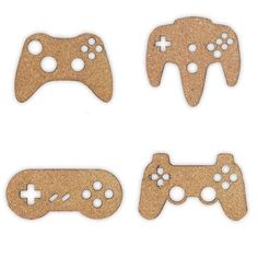 four wooden video game controllers with holes in them