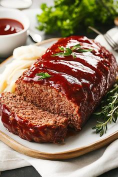 meatloaf with sauce and mashed potatoes on a plate