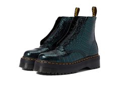 Dr. Martens Sinclair - Women's Boots : Green Wild Croc Emboss : Featuring an allover printed design, the Dr. Martens Sinclair Boots come with an ankle-length construction. Leather upper. Leather and textile lining. Leather and textile insole. Features classic Doc's DNA, including grooved heels, scripted heel loop, and visible yellow stitching. Goodyear welt construction where the upper and sole are heat-sealed and sewn together with the classic Z-welt stitching for long-lasting durability and fl Winter Outfits With Doc Martens, Green Doc Martens, Doc Martens Heels, Dr Martens Sinclair Boots, Croc Outfits, Dublin Fashion, Dr Martens Sinclair, Leopard Print Loafers, Doc Martens Outfit