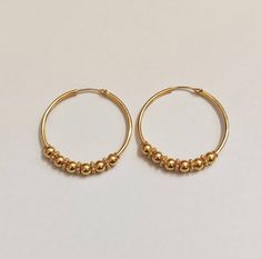 22k Hallmarked Gold Hoops, Indian Gold Hoops, Rajasthani Ball Hoops, Large Size Hoops, Classic Gold Hoops, Gold Earrings, Gold Jewelry Handmade Classic 22k Solid Gold Hoops Decorated with Tiny Multiple Balls, A forever design and a Classy look Gold Hoops for your Daily wear as well shine in your party. Metal: 22k Hallmark Gold ( tested in indian Lab) Size: 36mm Round Wire Goes in ear: 0.7mm (normal  piercing) Weight of Gold : 8 Gram nearly a oair Theme: Indian Rajasthani Hoops. We welcome custom Indian Hoop Earrings Gold, Gold Earrings Designs Simple Daily Wear, Simple Ear Rings Gold Daily Wear, Round Ear Rings, Daily Wear Earrings Gold, Gold 22k Jewelry, Ear Rings For Women Daily Wear Gold, Earrings Rings Hoop Gold, Daily Wear Gold Rings For Women Simple