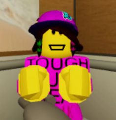 a lego person wearing a purple shirt and hat