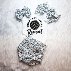 This Adorable Volleyball print is perfect for your little one going home from the hospital outfit or baby Announcement Photos. Whether they are a future Volleyball or watching a game on the couch your little one is bound to turn heads in this number.  Perfect baby shower gift for Sports enthusiast.   Choose from adorable baby shirt,bummies (diaper cover), skirted bummy, Head wrap, Hair Bow, Hat, Pants or any combination.  Comfortable Stretch fabric ensures a longevity of the fit while being brea White Cotton Cheerleading Sets, White Fitted Diaper Cover For Playtime, White Printed Sets For Playtime, White Printed Sets For Playwear, White Printed Playwear Sets, White Letter Print Sets For Playtime, Playful White Diaper Cover For Playwear, Sporty White Playtime Sets, Announcement Photos