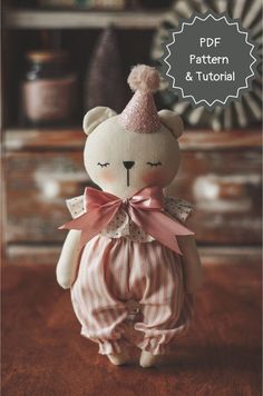 a teddy bear with a pink bow on its head is standing in front of a dresser