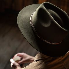 One look at the Jackson will have you dreaming of getting outside, off the beaten trail, and into the wild. Beloved for both its practicality and unique style, it’s the perfect hat to pull on before heading into the unknown. Made from a blend of quality felt and soft merino wool, it’s water-resistant, lightweight, and easy to care for. Dyed in two handsome shades inspired by nature’s warmth — Bronze and Sage — it features a subtle pinch-front crown and slender bound-edge brim. At once discreet a Aussie Hat, Custom Cowboy Hats, Getting Outside, Outdoor Hat, Outback Hat, Into The Unknown, Men’s Boots, Casual Bottoms, Outdoor Hats