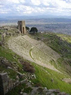 an ancient roman amphith on top of a hill in the middle of nowhere