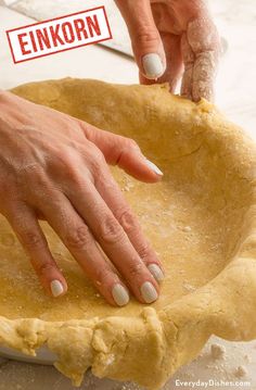 a person is kneading dough into a pie crust on a table with the words enkorn above it