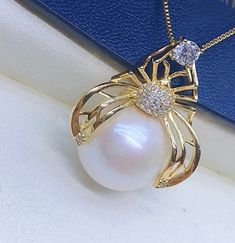 Lovely Big Freshwater White Pearl Pendant, 13.7mm, Bright Creamy White Color with light pink overtone, High Luster.  Sterling Silver S925 with sparkling cubic zircons, Very Well made. Cute Spider Pearl Pendant.  Cute and Lovely   Super Value  Pearl ★ Pearl: Genuine Freshwater White Pearls, Edison ★ Origin: China ★ Size: 13.7mm ★ Shape: Near Round ★ Color: Natural untreated, Bright Creamy White Color with light pink overtone ★ Luster: High Luster ★ Surface: Nice, natural marks, gentle texture, Mo Pearl White Rhinestone Jewelry For Gifts, White Pearl Jewelry With Prong Setting, Fine Jewelry White Rhinestone Jewelry, Fine White Jewelry With Rhinestones, White Fine Jewelry With Rhinestones, Pearl White Round Cubic Zirconia Jewelry, White Rhinestone Round Jewelry, Cute Spider, Creamy White