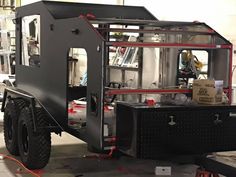 an off road vehicle is parked in a garage