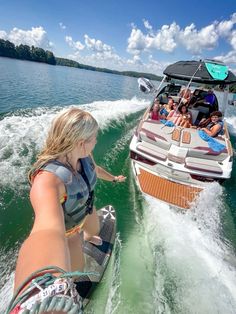 a group of people riding on the back of a boat