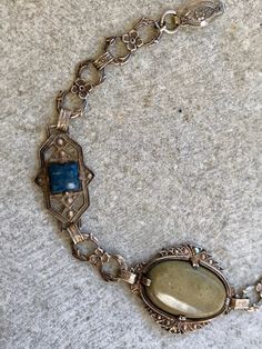 Circa 1920s Beautiful French Art Deco Ornate Sterling Silver Green Stone Blue Sodalite Vintage Bracelet Art Deco Jewelry Bracelet measures over 7 inches Weighs 8.22 grams This listing is for the Bracelet Only See matching necklace in link below https://www.etsy.com/listing/643213962/circa-1920s-beautiful-french-art-deco?ref=listing-shop-header-1 Vintage Blue Bracelet For Formal Occasions, Vintage Blue Oval Bracelet, Vintage Blue Oval Bracelets, Vintage Sapphire Jewelry For Collectors, Vintage Natural Stone Bracelet, Antique Blue Bracelet Jewelry, Vintage Lapis Lazuli Round Jewelry, Vintage Lapis Lazuli Jewelry For Gifts, Vintage Lapis Lazuli Jewelry As Gift