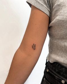 a person with a small tattoo on their arm