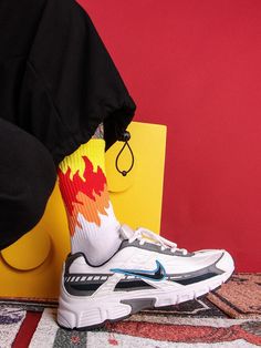 Ignite your street style with our versatile fire socks. Introducing our latest creation for the urban fashion frontier: the flame socks. These are a testament to the young urbanites who dare to stand out and tread with passion. With intricate flame designs adorning their silhouette, these socks aren't just stylish; they define a new era of urban sophistication. These men's flame socks are more than an accessory for the discerning gentleman navigating the city's concrete jungles. They are a proclamation of style, an assertion of individuality. As you stride forward, these fire-flame socks cover your feet but also illuminate your path, setting every step ablaze with audacity. Durable, comfortable and flamboyantly crafted, these fiery socks enhance your ensembles. Size: 37-43 Ultra-resistant Trendy White Socks For Streetwear, Trendy White Streetwear Socks, Flame Socks, Apocalyptic Clothing, Techwear Pants, Urban Sophistication, Flame Design, Chest Rig, Nike Huarache