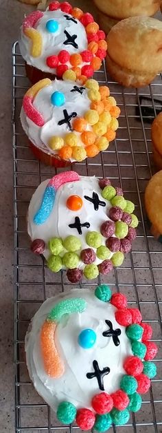 there are many decorated cookies on the cooling rack