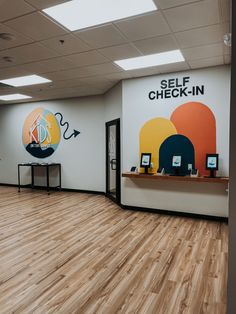 the inside of a self check - in store with wooden floors