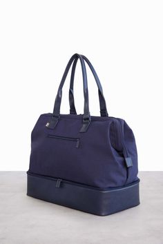 Navy Weekender Bag | Béis Functional Duffle Bag With Removable Pouch For On-the-go, Practical Large Capacity Travel Accessories For On-the-go, Functional Duffle Bag With Removable Pouch Tote, Functional Diaper Bag With Luggage Sleeve, Functional On-the-go Diaper Bag With Luggage Sleeve, Functional Tote Duffle Bag For Daily Use, Modern Tote Luggage For Overnight Trips, Functional Tote Weekender Bag, Functional Weekender Bag With Luggage Sleeve