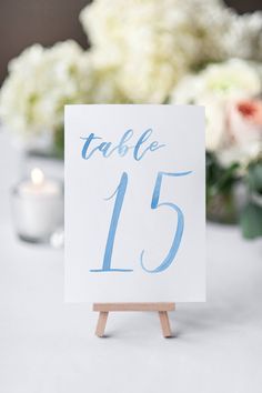 a table number is displayed on an easel