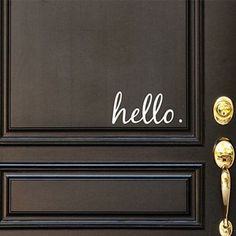 a black door with the word hello written on it