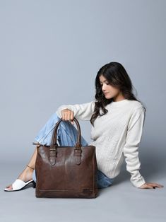 Introducing the City Chic Brown Leather Shoulder Tote—a versatile office bag designed for elegance and practicality. With a central compartment, inside pocket, and sturdy handles adorned with stylish buckles, it seamlessly blends class with functionality. Crafted from naturally tanned buffalo leather, this bag effortlessly transitions from office sophistication to casual chic. Perfect for brunch or quick outings with friends, it complements your style while prioritizing environmental responsibil Everyday Satchel Briefcase With Top Handle, Timeless Satchel For Daily Use, Timeless Everyday Satchel Briefcase, Timeless Satchel Laptop Bag For Daily Use, Timeless Tote Briefcase For Everyday Use, Business Satchel With Double Leather Handles, Timeless Tote Briefcase For Daily Use, Timeless Everyday Tote Briefcase, Everyday Timeless Tote Briefcase