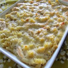 a casserole dish filled with macaroni and cheese sitting on a table